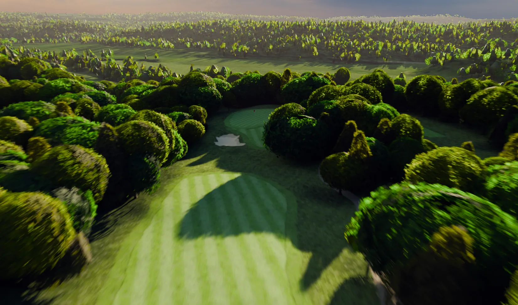 Low light through the tree line at the twelfth at River Ridge.