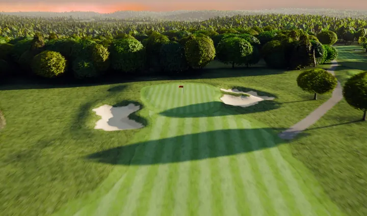 The third green at River Ridge and its scalloped bunker in golden light.