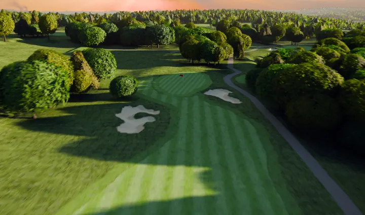 The tenth green at River Ridge under long tree shadows, pink horizon.
